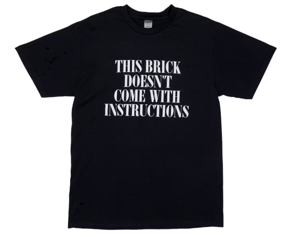 DropX™ Exclusive: Benny the Butcher x Bricks & Wood x Coachella Instructions Tee Black